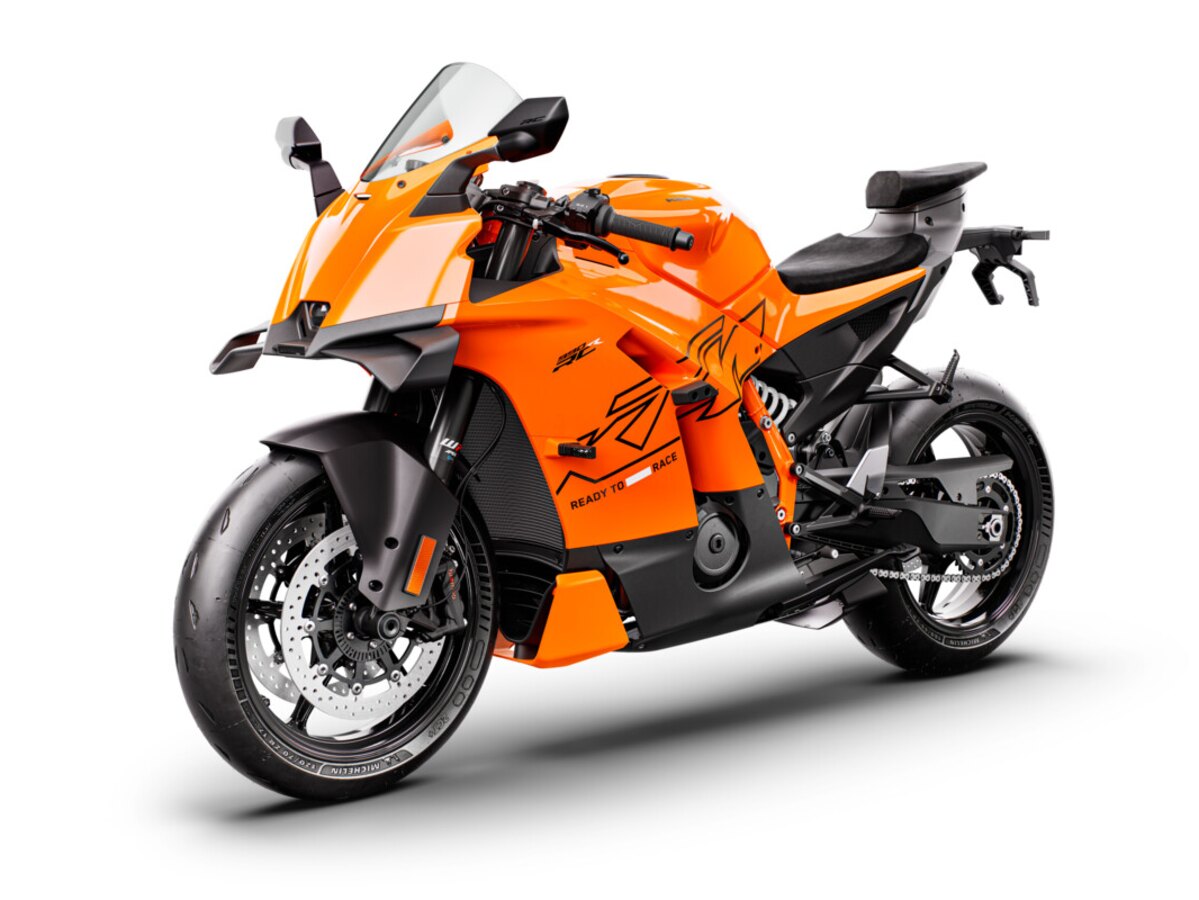 Three-quarter studio view of an orange KTM 990 RC R